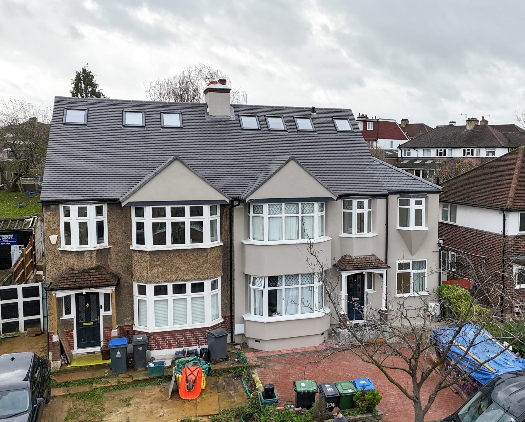 Extended and renovated semi-detached home in Kingston upon Thames with new roofline and skylights.